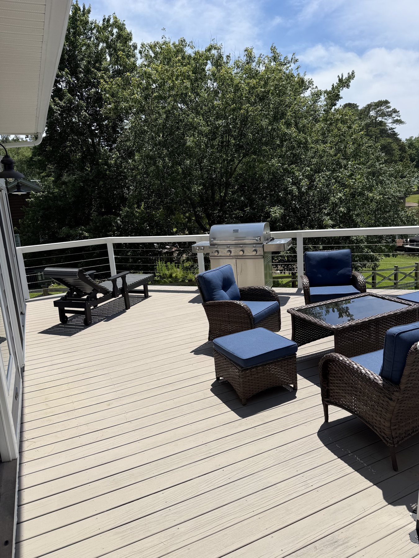 Outdoor deck seating and grill area ready for Lake Murray dinners.
