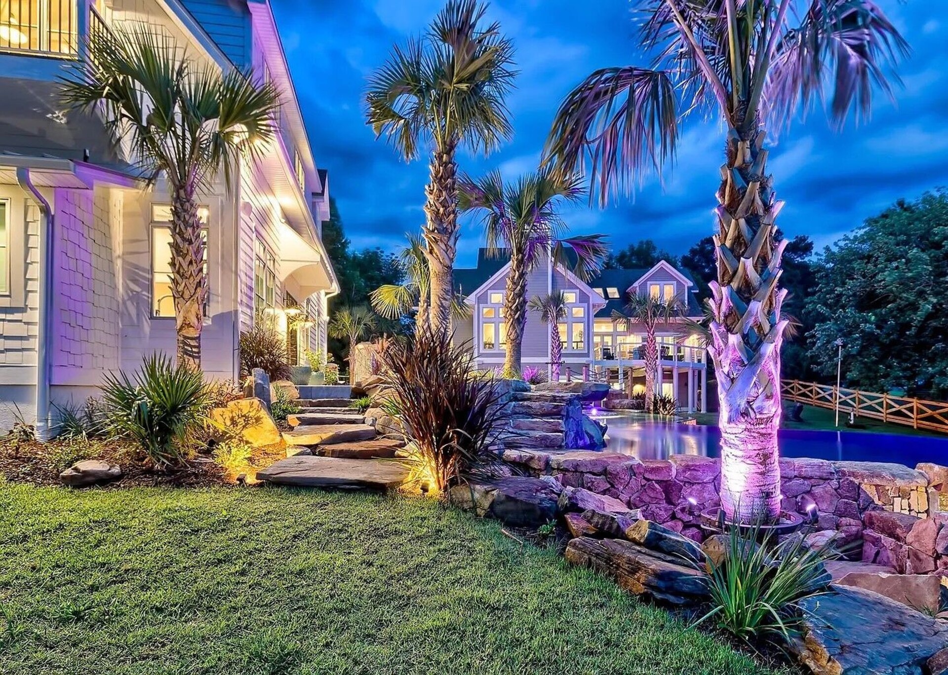 Pool and outdoor living area lit for an evening stay.